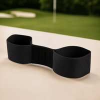 Black Arm Link golf swing connection trainer on a practice surface