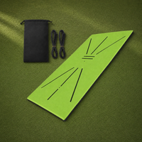 Swing Path Mat kit with carry pouch and cords on a golf practice surface